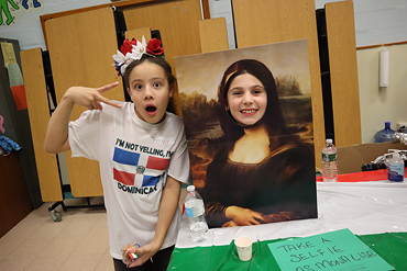 Families represented their cultures in many ways, such as an opportunity to take a selfie with Mona Lisa at the Italy booth.