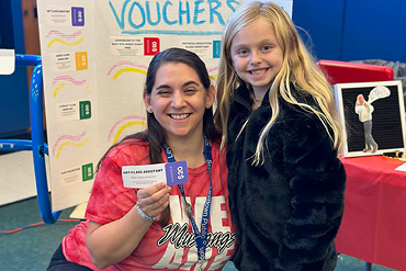 Art teacher Alyssa Arndt will have a new assistant for a day once Alexandra Lee uses her voucher.