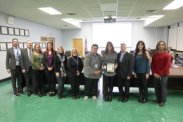 A staff member who went above and beyond to save the life of a student at East Broadway Elementary School was honored at the Levittown Board of Education meeting on Nov. 29.