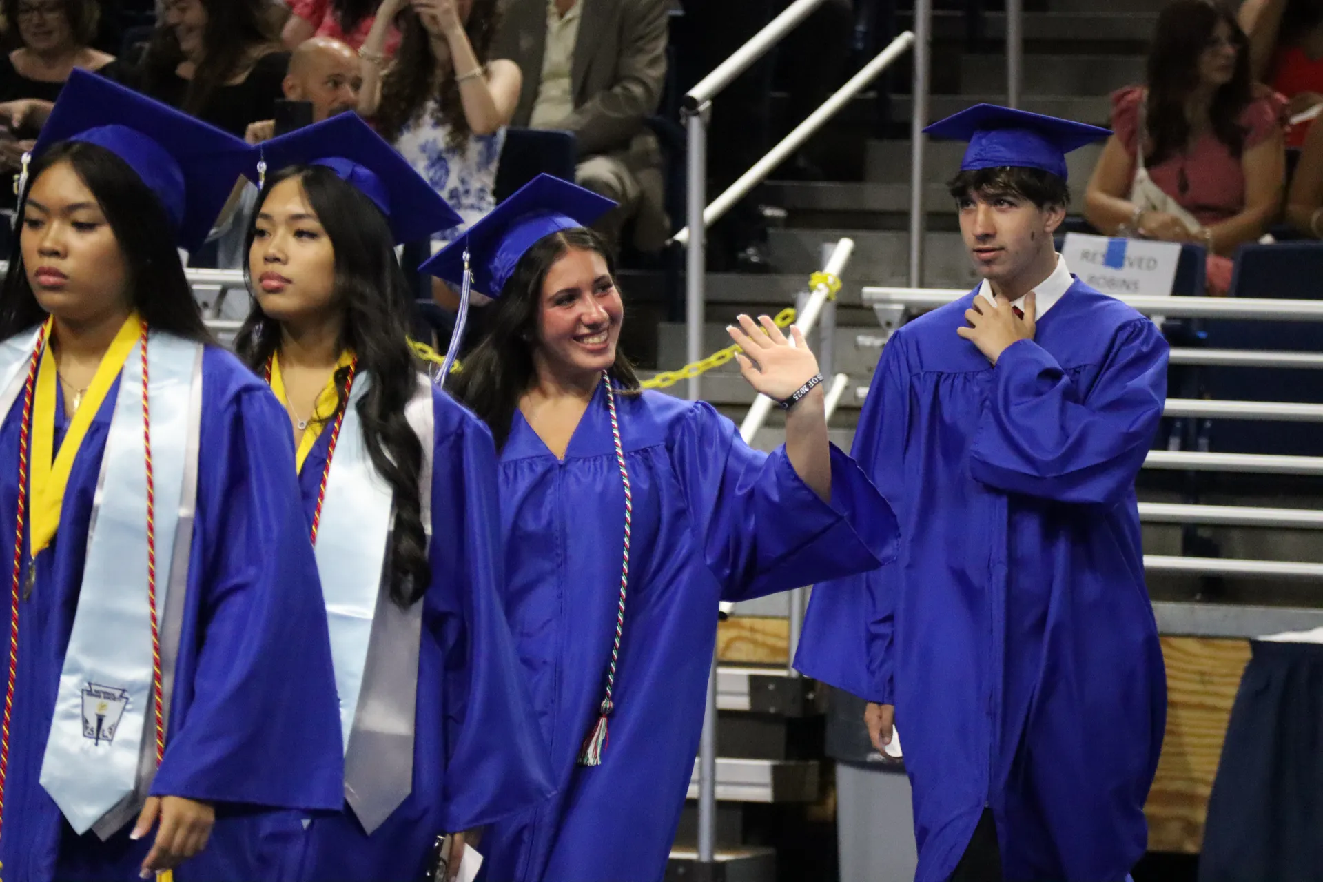 Graduates waved to loved ones as they processed toward their seats.