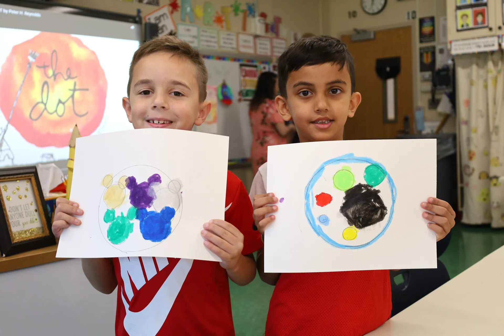 Lee Road Elementary School students Aaron Kane and Aarav Mahajan showed off their Dot Day artwork on Sept. 11. Lee Road Elementary School students Aaron Kane and Aarav Mahajan showed off their Dot Day artwork on Sept. 11.