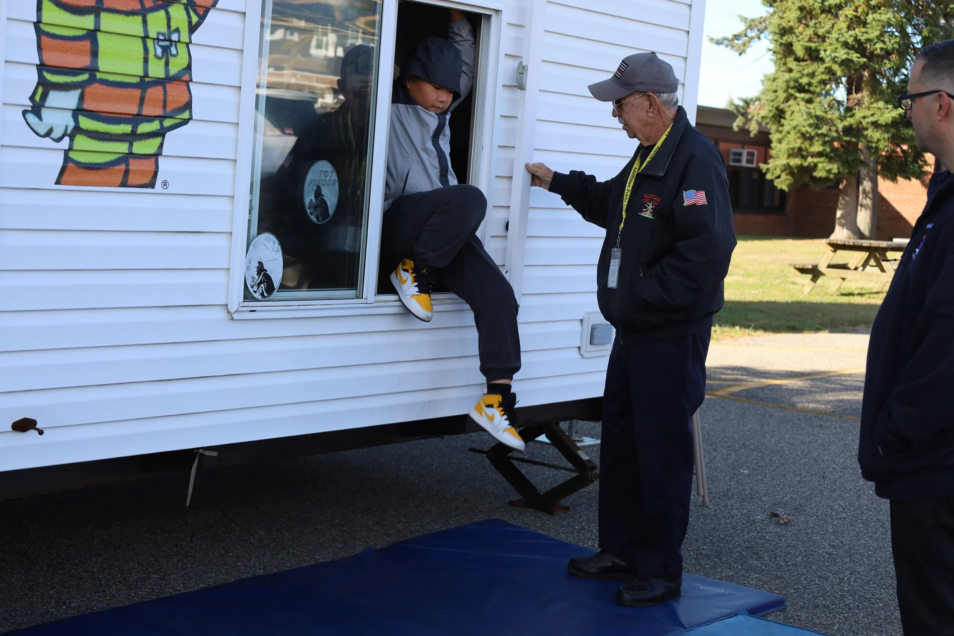 One by one, East Broadway Elementary School students jumped out of the Wantagh Fire Department smokehouse to safety on Oct. 16. One by one, East Broadway Elementary School students jumped out of the Wantagh Fire Department smokehouse to safety on Oct. 16.