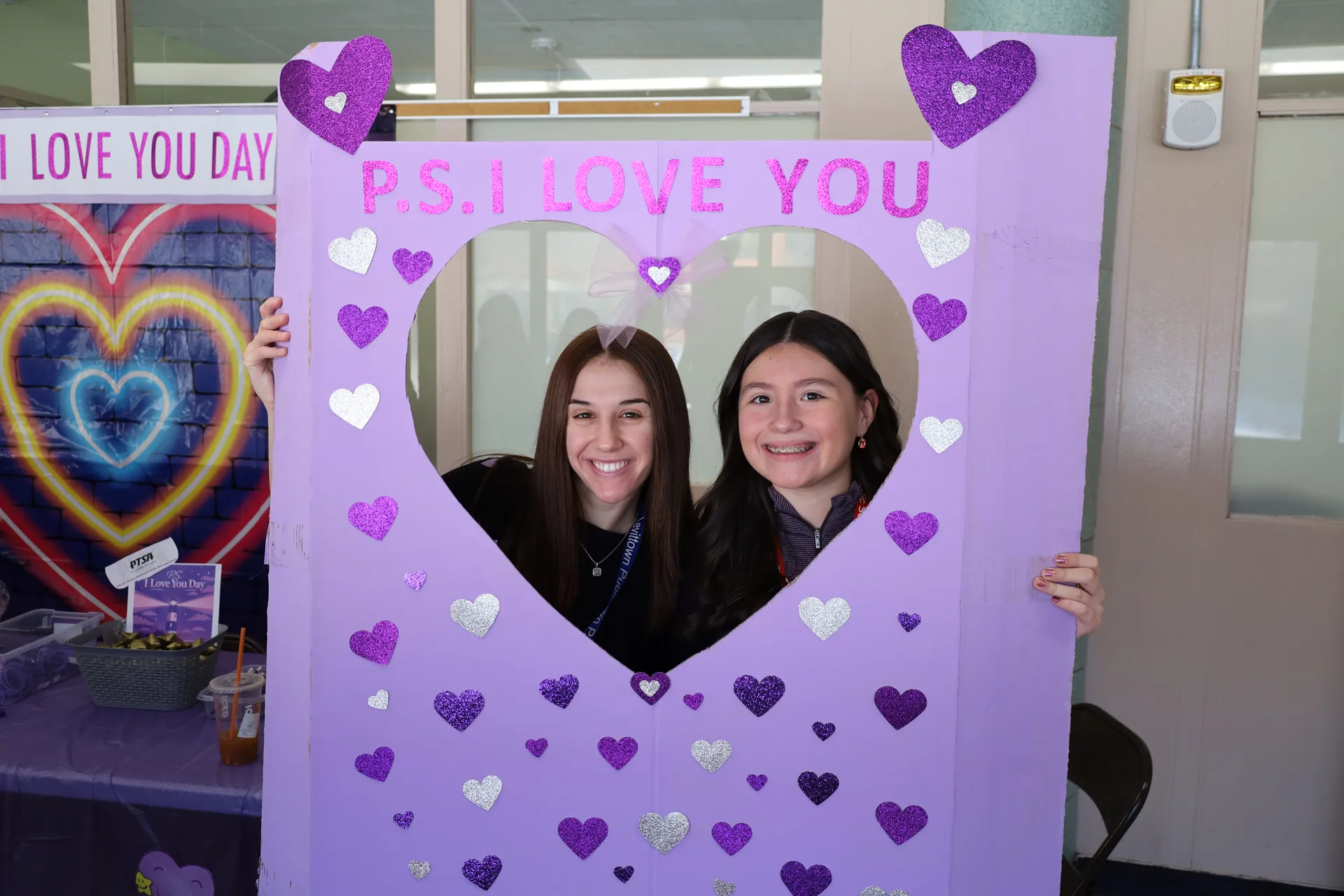 Family and consumer science teacher Molly Neary and sixth grader Maryann Munar posed in Salk's photobooth.