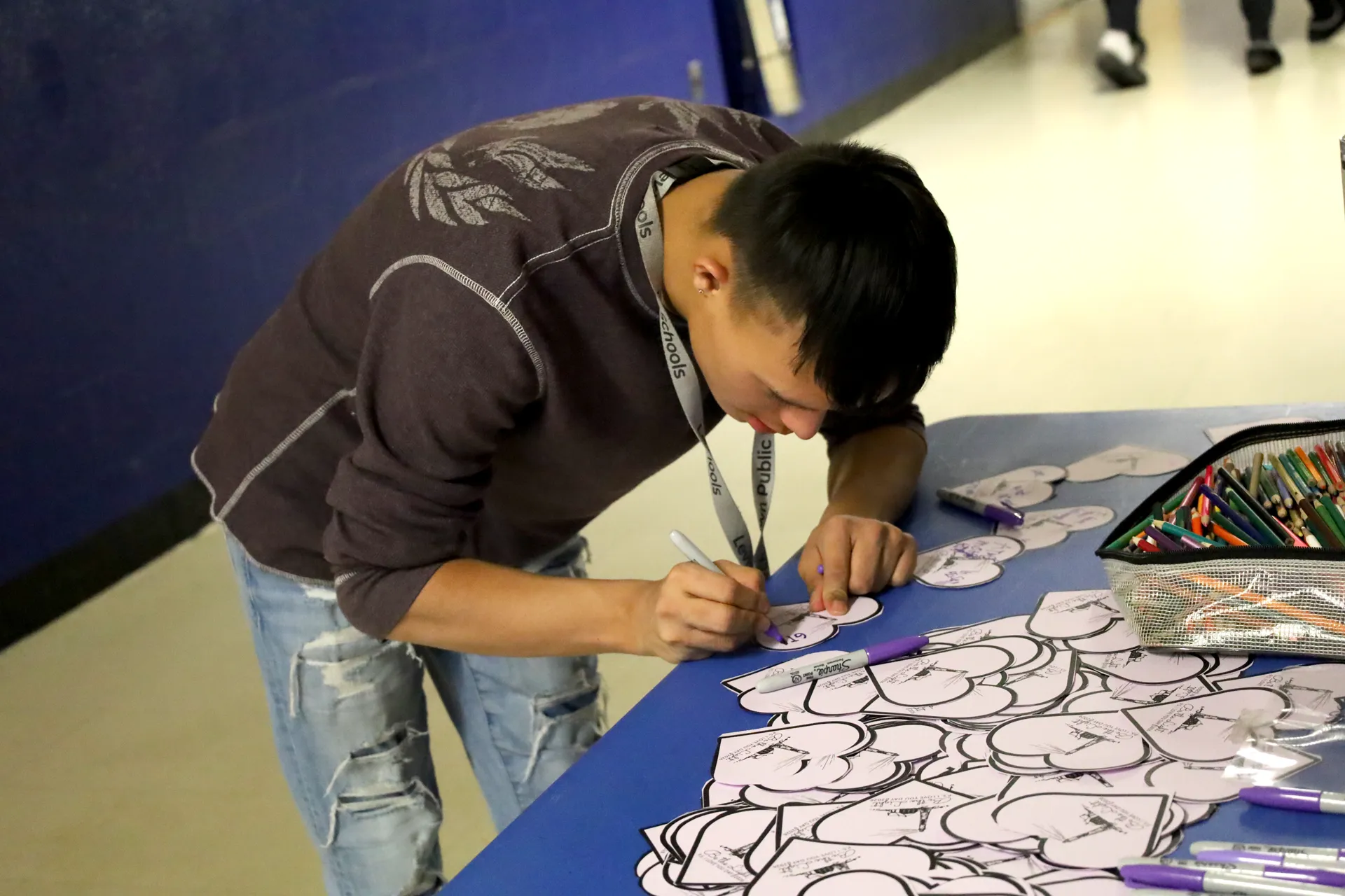 Student Aimar Montoya wrote a positive message to a friend on a paper heart.